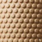 Close-up of embossed kraft bubble paper surface showing globular round-dome pattern — single-layer kraft paper cushioning, no plastic film