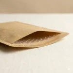 Open end cross-section of kraft paper bubble flat bag showing kraft paper outer layer and PE bubble film inner layer