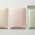 Pastel pearlescent bubble mailer bags in champagne, blush pink, and sage green — large bubble dome texture, matte satin finish, custom color options for premium e-commerce packaging
