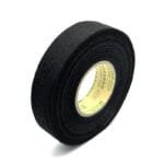 Black felt cloth tape protecting a wire harness branch point with soft conforming wrap