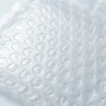 Close-up of transparent PE bubble bag surface — 10mm air bubble dome layer visible through clear film outer layer