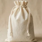 White non-woven drawstring bag with reinforced channel closure — custom PP fabric dust bag for retail and industrial packaging